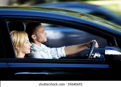 pic Two People Driving In A Car